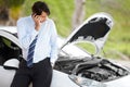 The engine just died on me. A man calling roadside assistance for help with his car trouble. Royalty Free Stock Photo