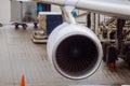 jet engine against a plane at the airport on loading Royalty Free Stock Photo