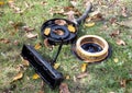 Engine parts air filter lies on grass with autumn leaves. DIY repair on street breakdown on the way