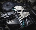 Engine repair old cars. Gloves. Tools.