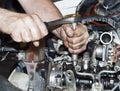 Engine repair. The tool in hands