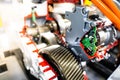 Engine sprocket And electronic circuit boards for control.Cross-section of a car gearbox. mechanics work in the garage.Shallow