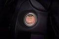 Engine start button of car with a orange light. Royalty Free Stock Photo
