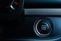 Engine start and stop button in car close up image