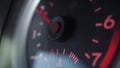 Engine starting, revving and stopping. Shallow focus close up tachometer video