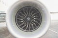 Engine of white passenger airplane at airport during snow blizzard. Royalty Free Stock Photo