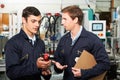 Engineer And Apprentice Discussing Component In Factory Royalty Free Stock Photo