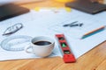 Engineer and Architect concept, Closeup coffee on desk with blueprints Royalty Free Stock Photo