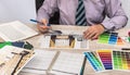 Engineer and architect concept - Designer creative working with  sketch plan blueprint and color sampler Royalty Free Stock Photo