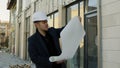 Engineer-architect holding plans on a construction site Royalty Free Stock Photo