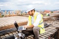 engineer, architect planning with laptop, using technology at construction site