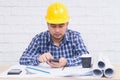 Engineer or Architect sitting working at his desk in the office Royalty Free Stock Photo