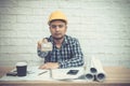 Engineer or Architect sitting, working at his desk in the office Royalty Free Stock Photo