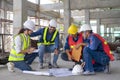 engineer or architect teamwork discussing,planning for a new home project in the building under construction Royalty Free Stock Photo