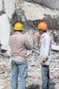 Engineer architect and worker operation control demolish old building