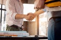 Engineer and architecture shaking hand after finish an agreement in the office. Civil engineering, Architect concept Royalty Free Stock Photo
