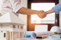 Engineer and architecture shaking hand after finish an agreement. Real estate agent shaking hands with customer for deal contract Royalty Free Stock Photo