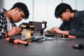 Engineer Asian Students Assembling Robotics Kits. Learning Mechanical Control, Robotics combines computer, electrical, mechanical Royalty Free Stock Photo