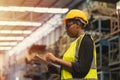 Engineer black women worker, Professional woman afican mechanical maintenance work in factory checking stock inventory in Royalty Free Stock Photo