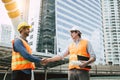 Engineer Boss get handshake, saying thank you to blue collar worker or team for doing work successfully. Employee happy. Blue