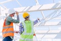 Engineer builder architect team working check roof beam construction progress structure building Royalty Free Stock Photo