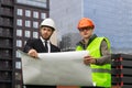 Engineer and builder explaining drawing architect plan professional