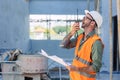 Engineer builder foreman work radio call in construction site. Architect worker project designer leader concept Royalty Free Stock Photo