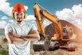 Engineer, builder in a helmet on the background of a construction site. Concept for construction, architecture, design, poster Royalty Free Stock Photo