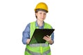 Engineer, builder, inspector woman in a protective reflective vest and a helmet on her head writes in a clipboard, isolated on a