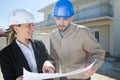 engineer builder woman and man outside site construction Royalty Free Stock Photo