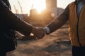 Engineer and businessman handshake at construction site AI generated Royalty Free Stock Photo