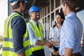 Engineer and businessman handshake at construction site Royalty Free Stock Photo