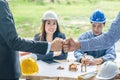 Engineer and businessman handshake, Teamwork between professional construction engineers after project complete , Royalty Free Stock Photo