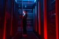 Engineer businesswoman works in network server room