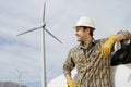 Engineer By Car At Wind Farm