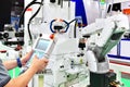 Engineer check and control automation white Modern Robot Arm system in factory