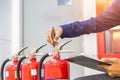 Engineer checking Industrial fire control system are checking fire extinguishers. Royalty Free Stock Photo