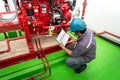 Engineer checking industrial generator fire control system