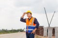 Engineer checking project at building site, Foreman worker in hardhats on construction site Royalty Free Stock Photo