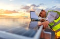 The engineer is checking the solar cell photovoltaic power station system on rooftop Royalty Free Stock Photo