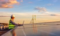 The engineer is checking the solar cell photovoltaic power station system on rooftop Royalty Free Stock Photo