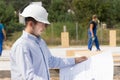 Engineer checking specifications on a plan Royalty Free Stock Photo