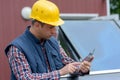 Engineer checks tablet operation in solar pannel Royalty Free Stock Photo