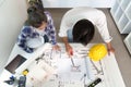 Engineer collaborating on architectural plans with a colleague Royalty Free Stock Photo