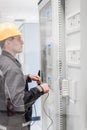 Engineer commissioning bay control unit. Engineering department Royalty Free Stock Photo