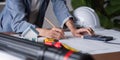 Engineer Conducting Measurements for Structural Design and Execution