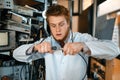 Engineer connects wires under tension in lab