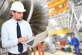 Engineer constructing gas turbines in a modern industrial factor