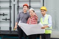 Engineer and construction team wearing safety helmet and blueprint on hand. Royalty Free Stock Photo