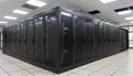It engineer / consultant working in a data center. This enclosures is a SAN (storage area network) and servers Royalty Free Stock Photo